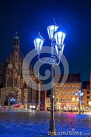 Blue street lights in front of the Frauenkirche in Nuremberg. The blue night 2023 Stock Photo