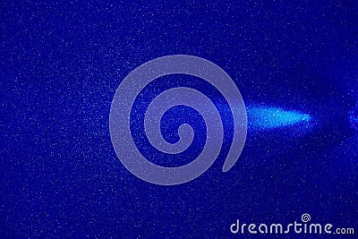 On a blue structural fine-grained background, a light blue beam of light Stock Photo