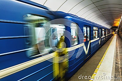 Blue subway train arrives at the station Stock Photo