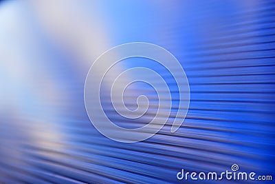 Blue surface of striped polycarbonate with a reflection of the blue distance of the city Stock Photo