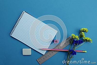 On the blue surface of the table are stationery. The concept of education Stock Photo