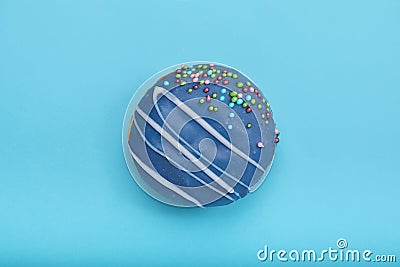 Blue sweet donut on a blue background. Concept blue on blue, mnimalism, sweet desserts. copy space blue background Stock Photo