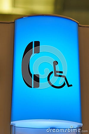 Blue telephone for handicap sign Stock Photo