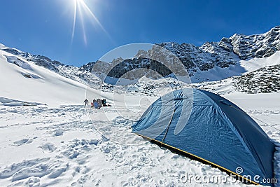 Blue tent in the base camp in the mountains Stock Photo