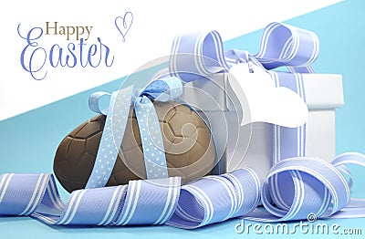 Blue theme Happy Easter chocolate egg and gift box with stripe ribbon Stock Photo