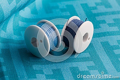 Blue thread on blue fabric Stock Photo