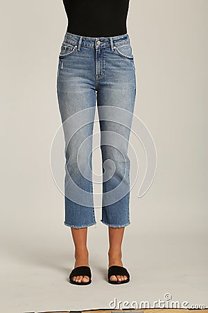 Blue tight jeans with black heels for woman Stock Photo
