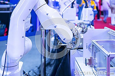 Blue tone two high technology & smart precision robot grip & automatic clamp or chuck for catch industrial automotive part such Stock Photo
