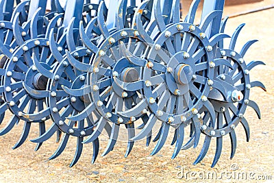 Blue toothed metal harrow for field tillage Stock Photo