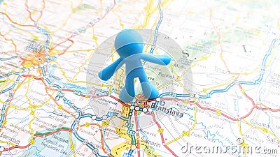 A blue toy man pin stuck in Bratislava on a map of Slovakia Stock Photo