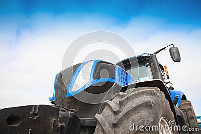 Tractor close-up against the sky Stock Photo