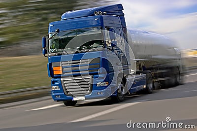 Blue Truck Driving Fast Stock Photo
