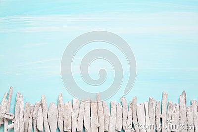 Blue or turquoise oceanic background with a fence of driftwood f Stock Photo