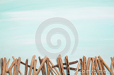 Blue or turquoise oceanic background with a fence of driftwood f Stock Photo