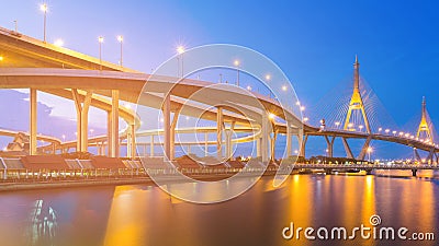 Blue twilight twin suspension bridge river front Stock Photo