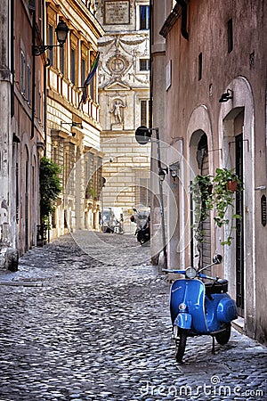 Blue Vespa in the old street of Rome Stock Photo