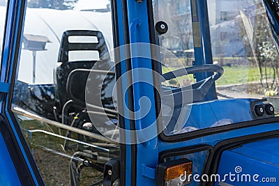 Blue tractor detail close up cabin view Stock Photo