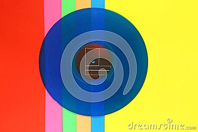 Blue Vinyl record on a colorful background. Retro style. Top view. Stock Photo