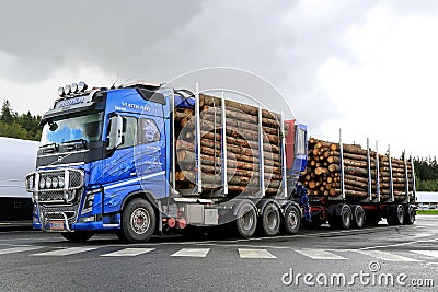 Blue Volvo FH16 700 Timber Truck with Log Trailer Editorial Stock Photo