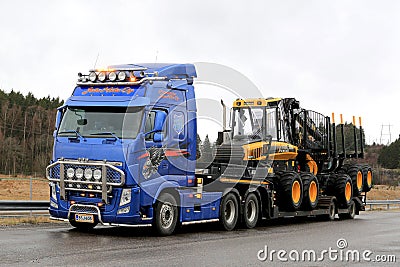 Blue Volvo FH13 Truck Hauls Ponsse Forwarder Editorial Stock Photo