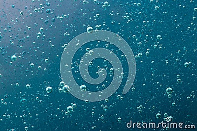 Blue water, air and oil mixed for a bubbly effect Stock Photo