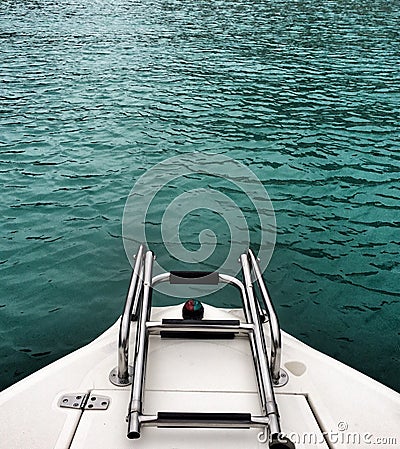 Blue water and boat ladder Stock Photo