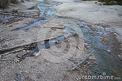 Blue water runoff from a geyser pool Stock Photo