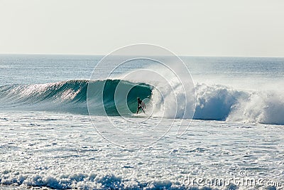 Blue Wave Surfer Left Behind Crashing Water Stock Photo