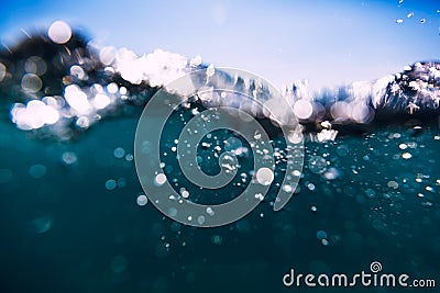 Blue waves in ocean. Water texture and bokeh. Stock Photo