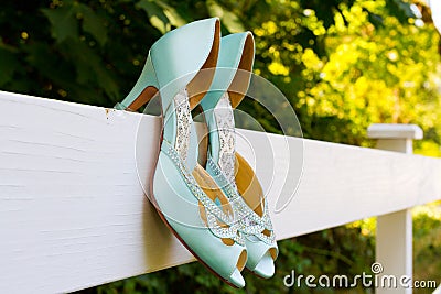 Blue Wedding Shoes on Fence Stock Photo