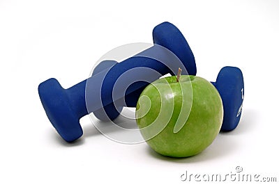 Blue Weights and Green Apple Stock Photo