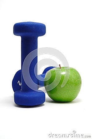 Blue Weights and Green Apple Stock Photo