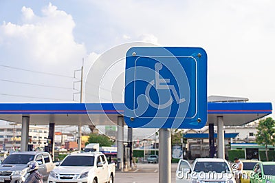 Blue wheel chair sign in gas station Editorial Stock Photo