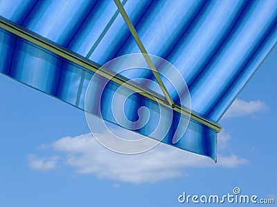 Blue and white canvas awning. blue sky and white cloud. sunny day Stock Photo