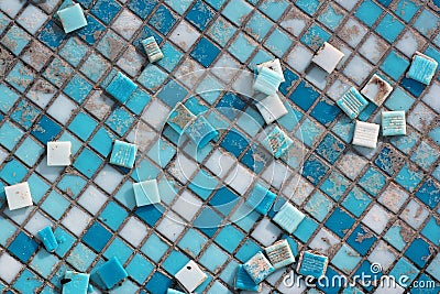 Blue and white ceramic tiles in abandoned swimming pool. Stock Photo