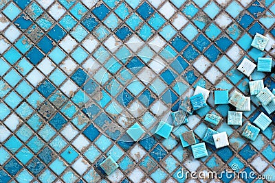 Blue and white ceramic tiles in abandoned swimming pool. Stock Photo