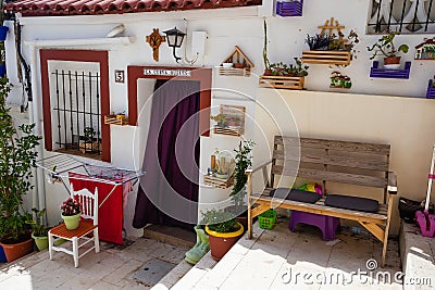 Blue and white houses in typical street in Barrio Santa Cruz in Alicante, Costa Blanca, Spain Editorial Stock Photo