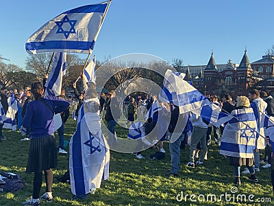 Blue and White Israeli Flags in the Breeze at the Protest Editorial Stock Photo