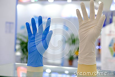 Blue and white latex gloves Stock Photo