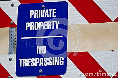 Blue and White Private Property Sign on Construction Barricade Stock Photo