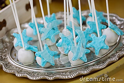 Blue and white star candy on sticks, marine thematic candy bar Stock Photo