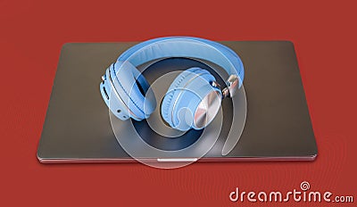 Blue wireless head on laptop top - music concept Stock Photo
