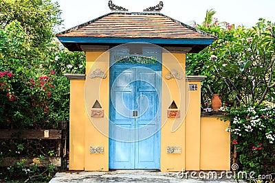 Blue wooden door of a house designed and decorated in Balinese style is beautiful and durable yet has a designer design that is Editorial Stock Photo