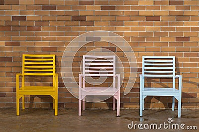 Blue yellow and pink wooden chair Stock Photo