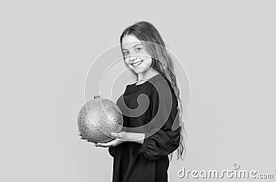 Blue and yellow. Shimmering glitter. Prepare decorations in advance. Girl hold golden ball decorations. Decorative Stock Photo