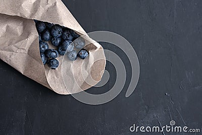 Blueberry antioxidant organic superfood in a paper packaging concept for healthy eating and nutrition Stock Photo