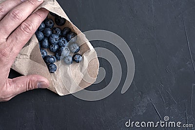 Blueberry antioxidant organic superfood in a paper packaging concept for healthy eating and nutrition Stock Photo