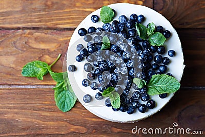 Blueberry cheesecake on a wooden background Stock Photo