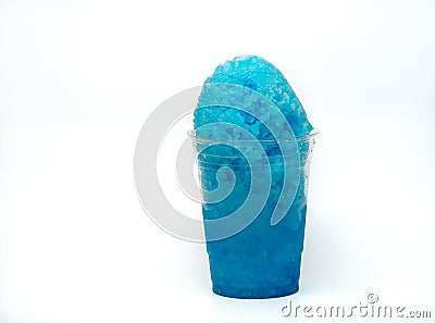 Blueberry Hawaiian Shave ice, Shaved ice or snow cone dessert in a clear plastic cup. Stock Photo