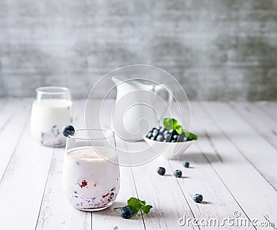 blueberry or mixed berry milk shake in a glass served for refreshment, healthy eating, dieting, morning breakfast Stock Photo